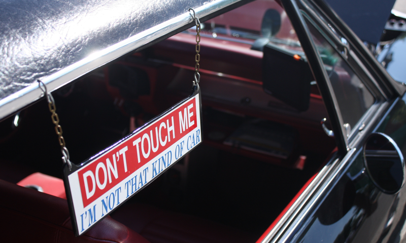 Illustration for article titled A Series of Increasingly Aggressive "Don’t Touch My Car" Warning Signs